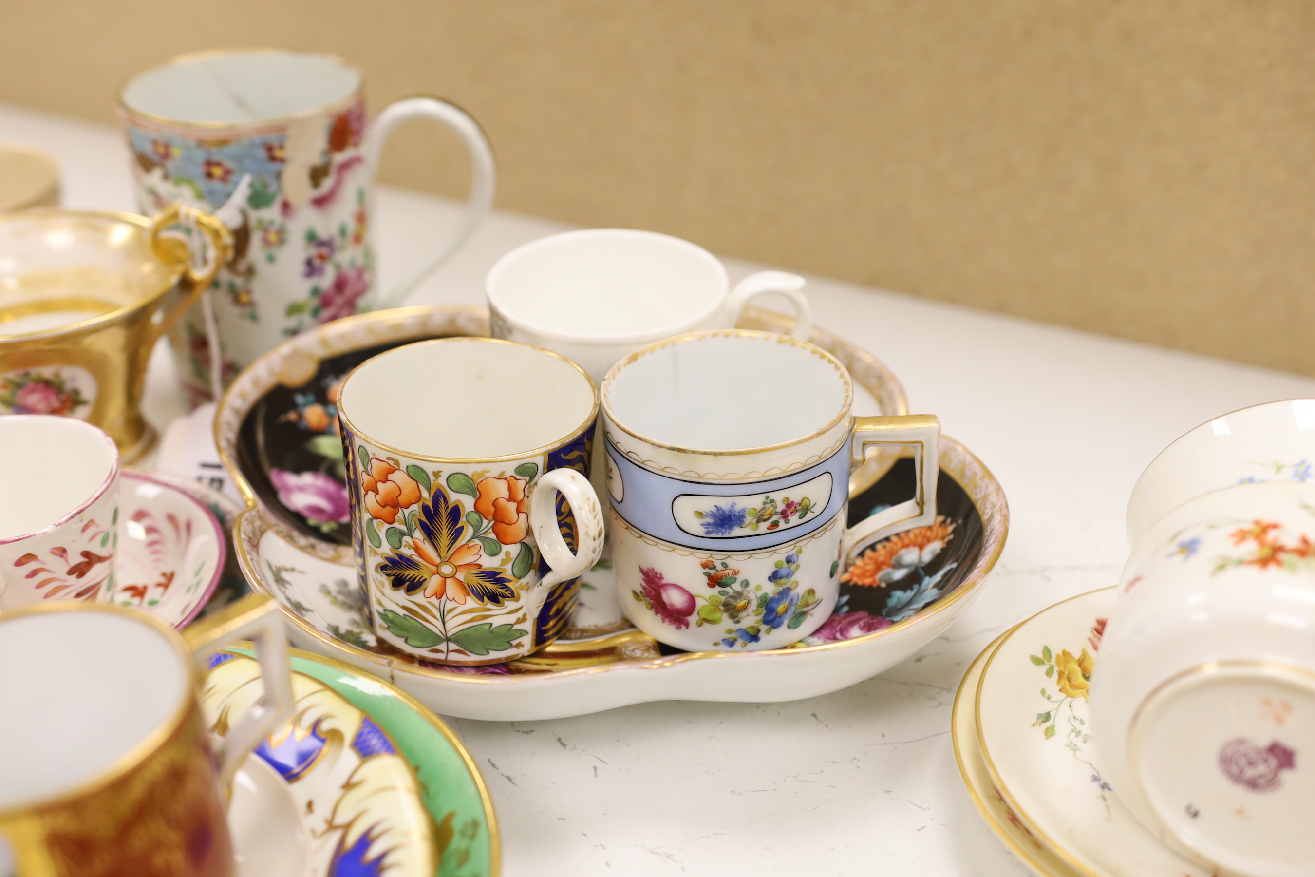 A collection of mixed 18th, 19th and 20th century Chinese and Continental teawares, including cups and sauces and two serving dishes